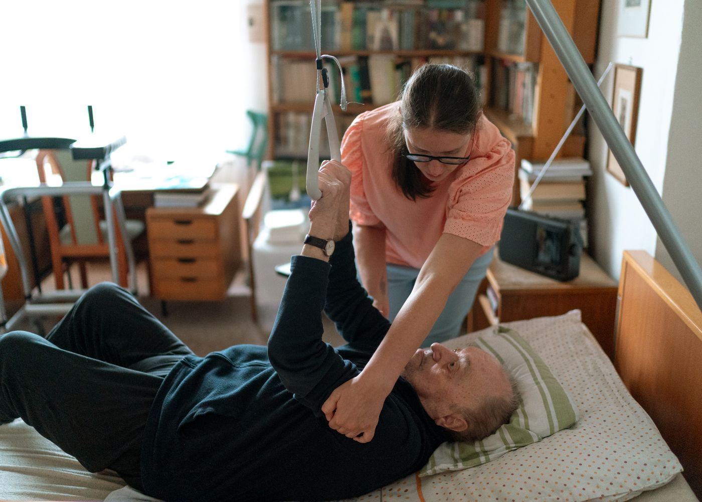 A live-in caregiver assisting a senior at home